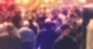 A blurred image of a crowd.